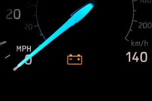Car dashboard with warning light glowing