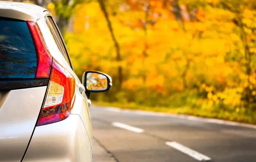 Car on autumn street